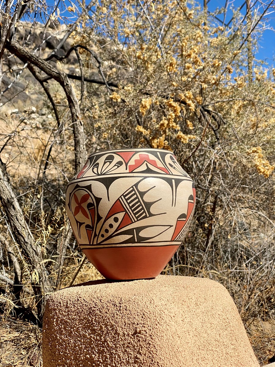 Pueblo pottery on a stucco wall.