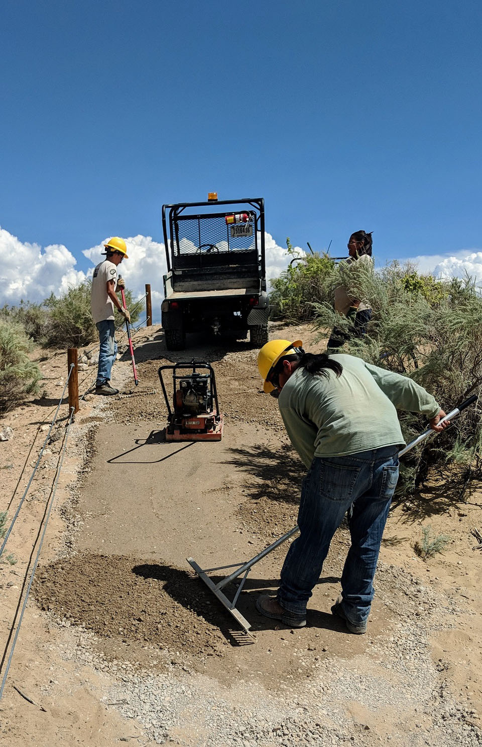 SWCC Rinconada Rehab 9_2018 Crew members from the Southwest Conservation Corps compacting trail.