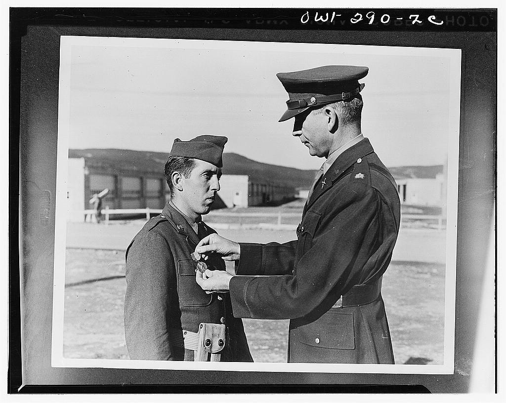 Private Andrew Shestock receiving the Soldiers Medal from Lieutenant Colonel E.E. Reid of the Newfoundland command for saving a Newfoundland citizen from drowning