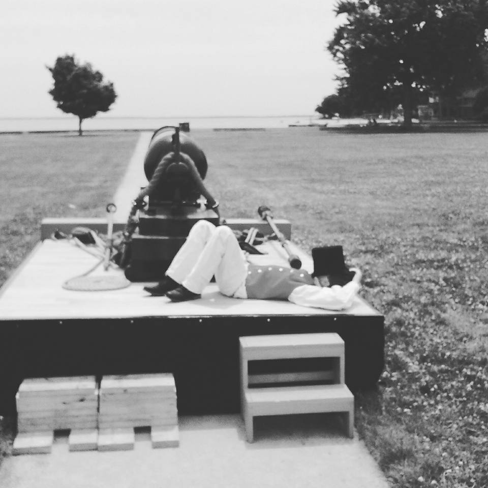 Powder Monkey sleeping on gun deck. Powder Monkey sleeping on gun deck.