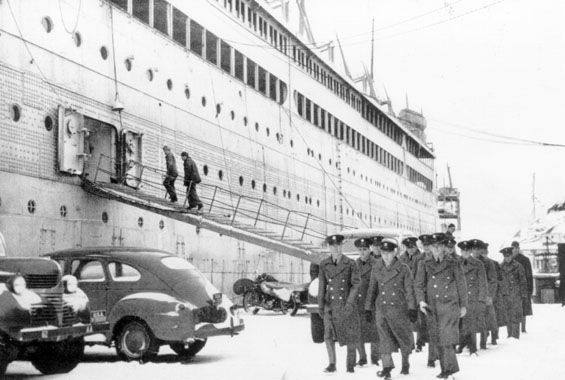 The port side of the Edmund B. Alexander, docked in the St. John's Harbour on the Southside, showing several US soldiers going into town on passes