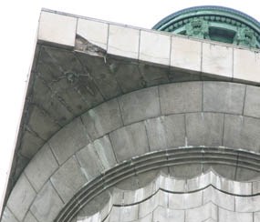 Damaged granite facing below observation deck of Perry's Victory