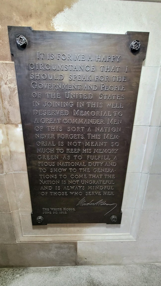 A cast bronze tablet measuring 28 in by 50 1/4 in inscribed with a dedication from President Woodro Wilson, June 30 1913.