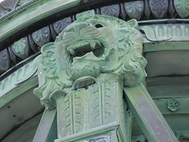 Patina green bronze lion on top of Memorial Patina green bronze lion on top of Memorial