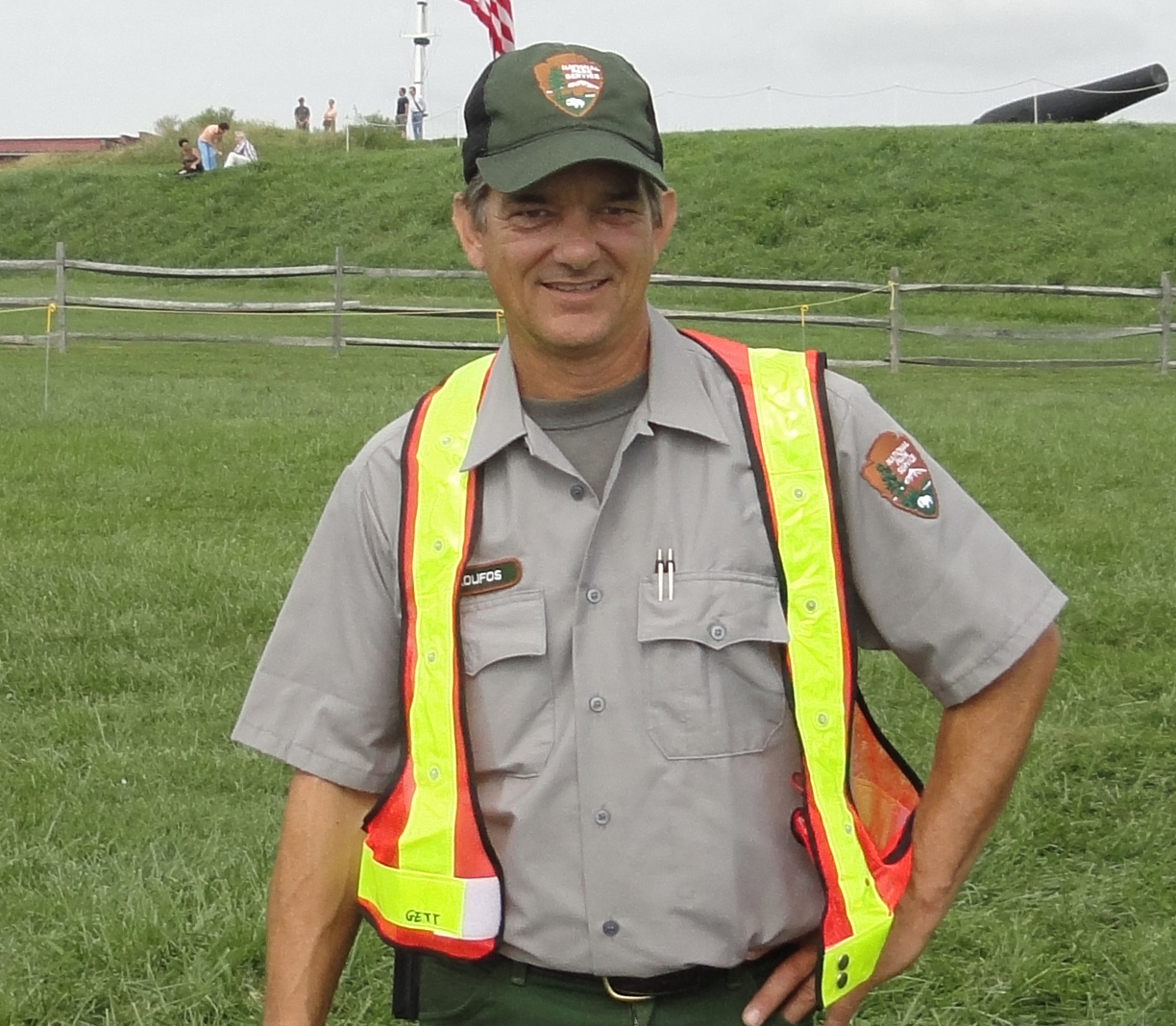 Dan Skoufos wearing the NPS maintenance uniform and orange vest.