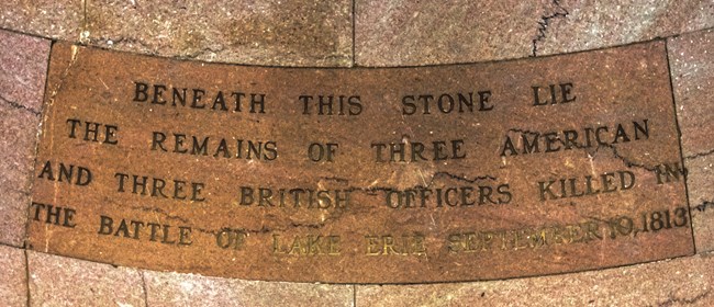 A granite stone flush with the rotunda floor marks the tomb of six officers killed in the Battle of Lake Erie.