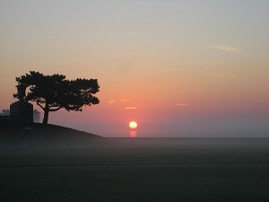 Sunrise over land and water