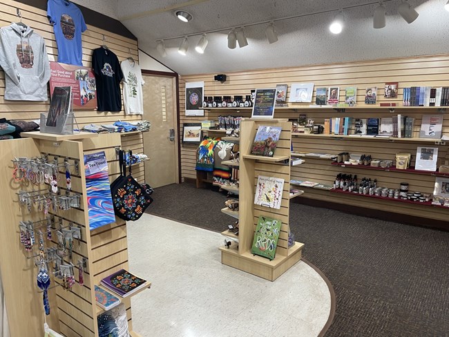 Items in a store including shirts, books, jewelry and more