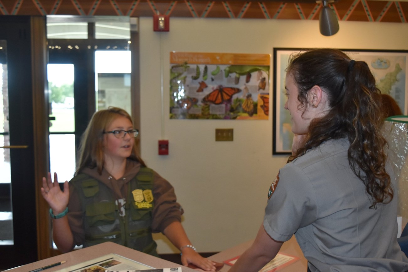 Park ranger swearing in a little girl