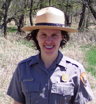 Portrait of Lauren Blacik in National Park Service uniform outdoors