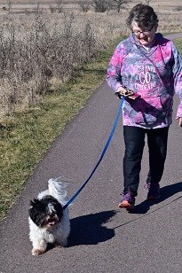 Woman walking a small dog