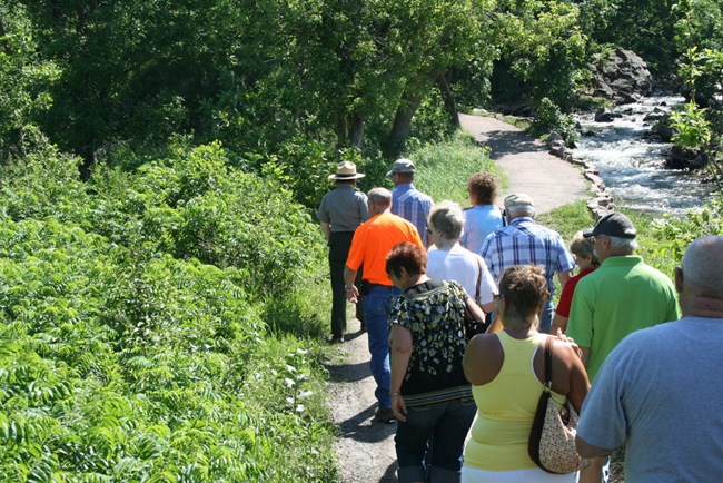 Ranger leading visitors along a path