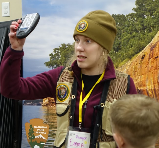 Intern showing something to children