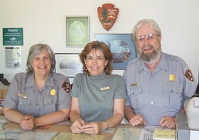 Judy, Ronnie, and Brody at the Grand Sable Visitor Center counter. Judy, Ronnie, and Brody at the Grand Sable Visitor Center counter.