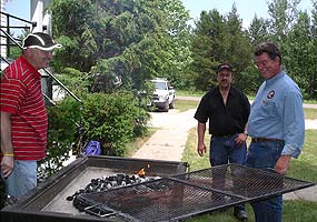 John, Don and Gregg around the barbeque at the employee reunion. John, Don and Gregg around the barbeque at the employee reunion.
