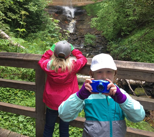 Kids taking pictures at Munising Falls