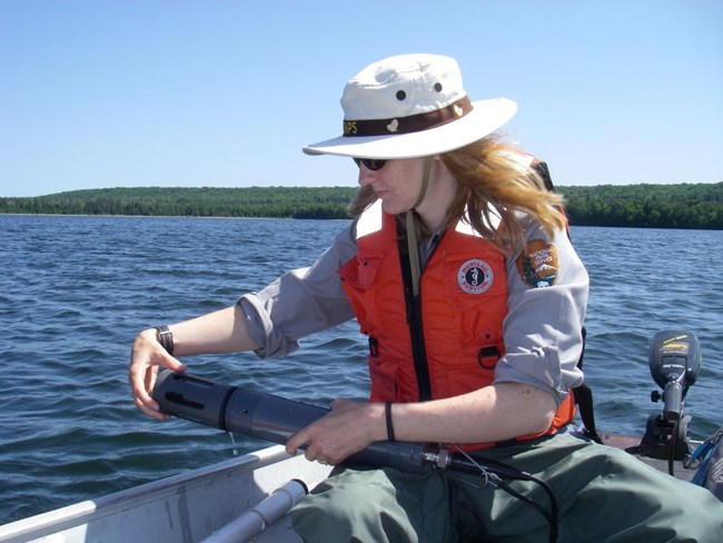 Researcher taking water quality samples
