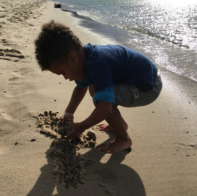 Young boy playing on the beach