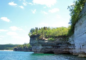 Blue sky, sunshine, Lake Superior, and the Pictured Rocks cliffs. Blue sky, sunshine, Lake Superior, and the Pictured Rocks cliffs.