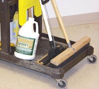 This custodian's cleaning cart contains non-toxic products, and of course a broom.