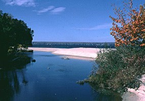 The Miners River flows toward Lake Superior on a clear summer day. The Miners River flows toward Lake Superior on a clear summer day.