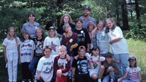 Youth from a summer Junior Ranger program strike a pose with Rangers Karen and Dave.