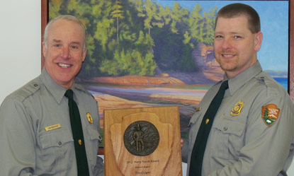 PRNL Superintendent Northup presents Chief Ranger Colyer with the 2012 Midwest Region Harry Yount Award.