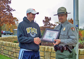 Scott Sherrod receives an NPS search and rescue award from PRNL Chief Ranger Tim Colyer.