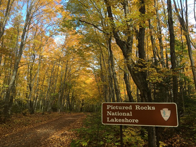 Entrance sign to Pictured Rocks National Park in fall