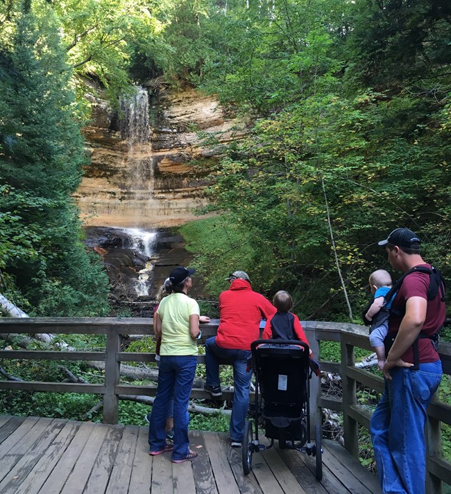 Family visiting Munising Falls