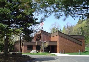 Amid the forested ravines of the Marquette Iron Range, the Michigan Iron Industry Museum overlooks the Carp River and the site of the first iron forge in the Lake Superior region.
