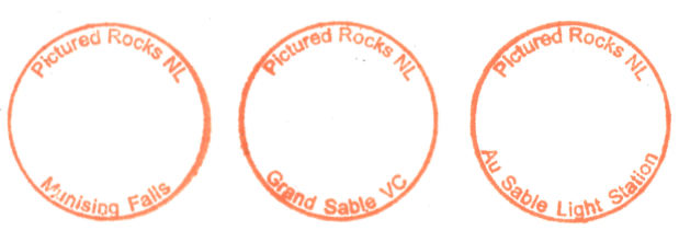 three stamp images; each shaped as a circle. All say Pictured Rocks NL along the top inner edge. On the bottom, one says Munising Falls, another Grand Sable VC, and the last Au Sable Light Station.