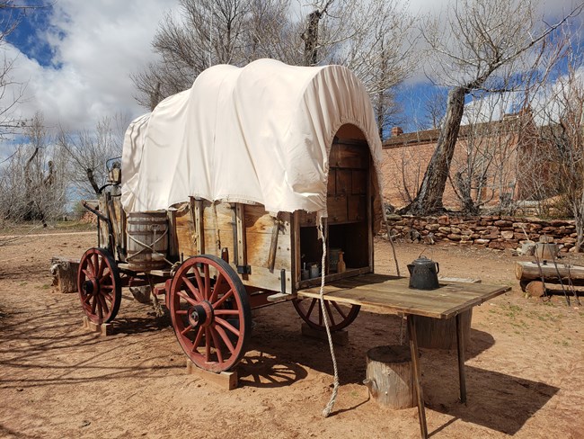 A chuckwagon is set up and ready for a meal