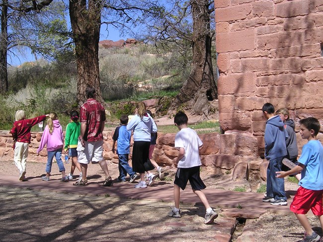Children walk alongside Winsor Castle