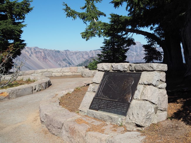 A bronze plaque set in native stone, The Mather Memorial, honors Stephen T Mather, the first director of NPS. It is located at the entry to an overlook along the Rim Promenade.