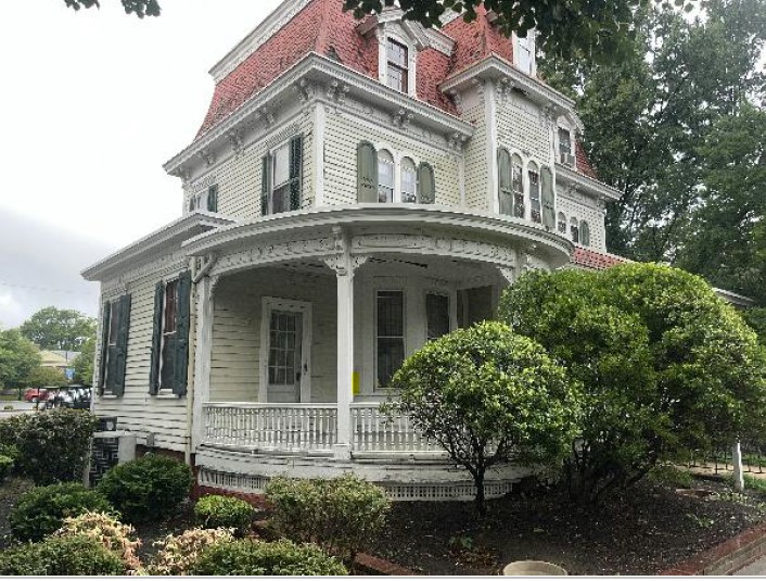 Delaware State Hope House A pre-1885, three-story frame building with Queen Anne architectural features including a mansard roof and an expansive porch.