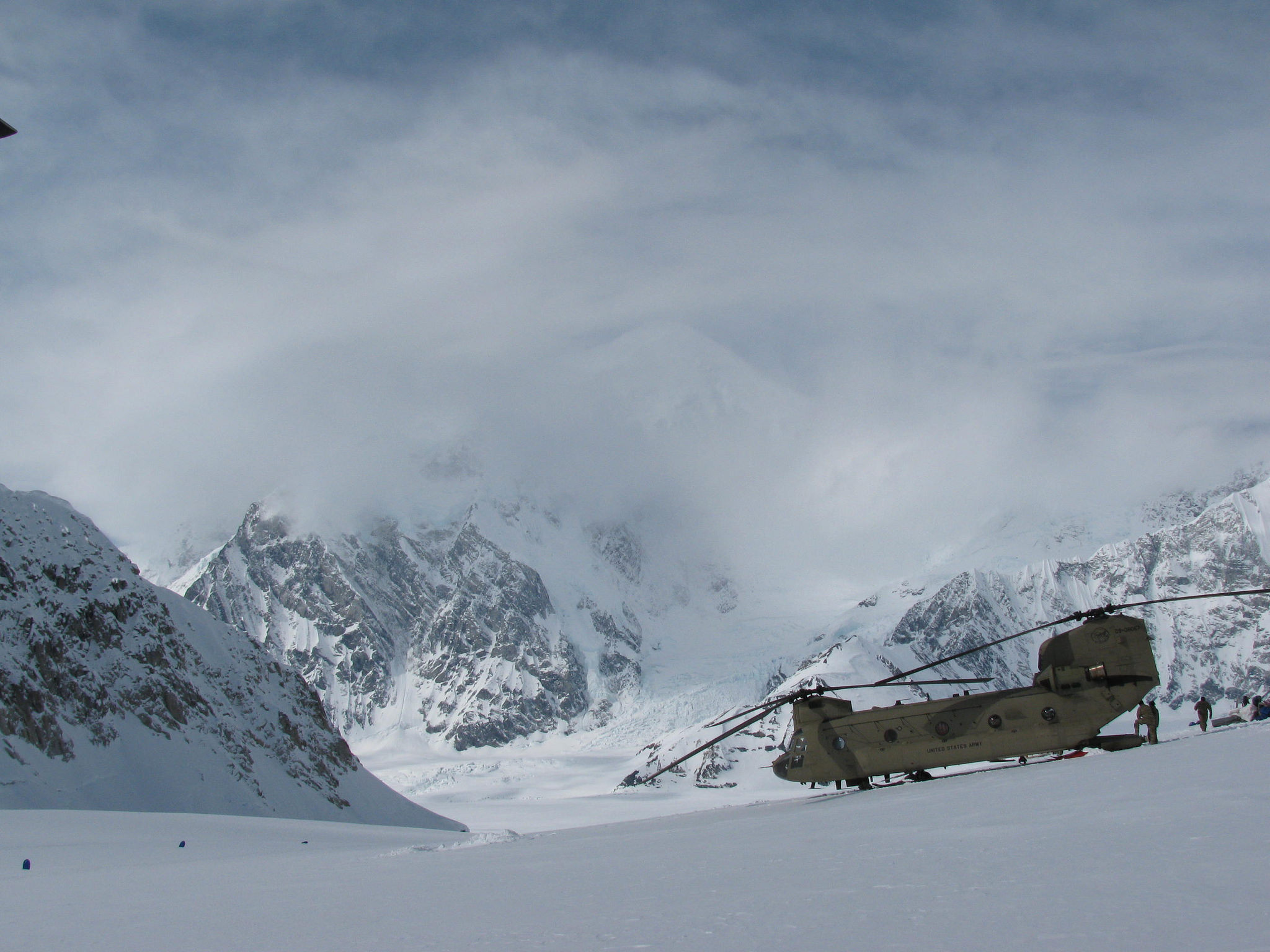 Setting Down A CH-47 lands on the Kahiltna Glacier, surrounded by snowy peaks