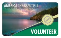 2019 Volunteer Pass The 2019 Volunteer Pass appears with a rocky mountain, water and night sky