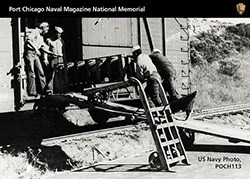 Trading Card showing African American men loading ammunition onto a train car.