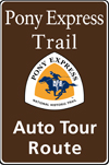 Brown highway auto tour route sign with Pony Express logo and text: Pony Express Trail Auto Tour Route. Brown highway auto tour route sign with Pony Express logo and text: Pony Express Trail Auto Tour Route.