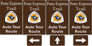 Four vertical rectangle brown highway signs with white text saying: California Trail Auto Tour Route and the triangular California Trail logo in yellow and white. Four vertical rectangle brown highway signs with white text saying: California Trail Auto Tour Route and the triangular California Trail logo in yellow and white.