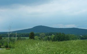 a view of a singular, cone-shaped hill