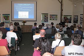 Project Manager Lorraine Parsons giving a PowerPoint presentation on Changes in Water Quality during the Giacomini Wetland Restoration Project's 1-Year Celebration at the Red Barn Classroom. Project Manager Lorraine Parsons giving a PowerPoint presentation on Changes in Water Quality during the Giacomini Wetland Restoration Project's 1-Year Celebration at the Red Barn Classroom.