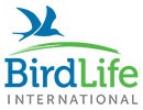 The words BirdLife International under a cartoon of a tern flying over a green arc.