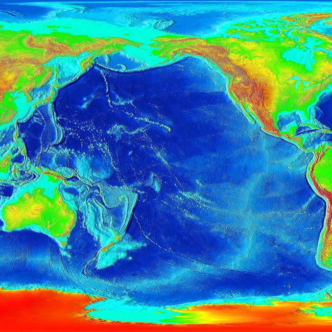 A color map indicating the depth of the Pacific Ocean floor. Dark blue represents deep oceans, light blue represents shallow waters.