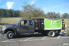 A truck with a green banner on the side collecting e-waste at Bear Valley Visitor Center on November 15, 2012.