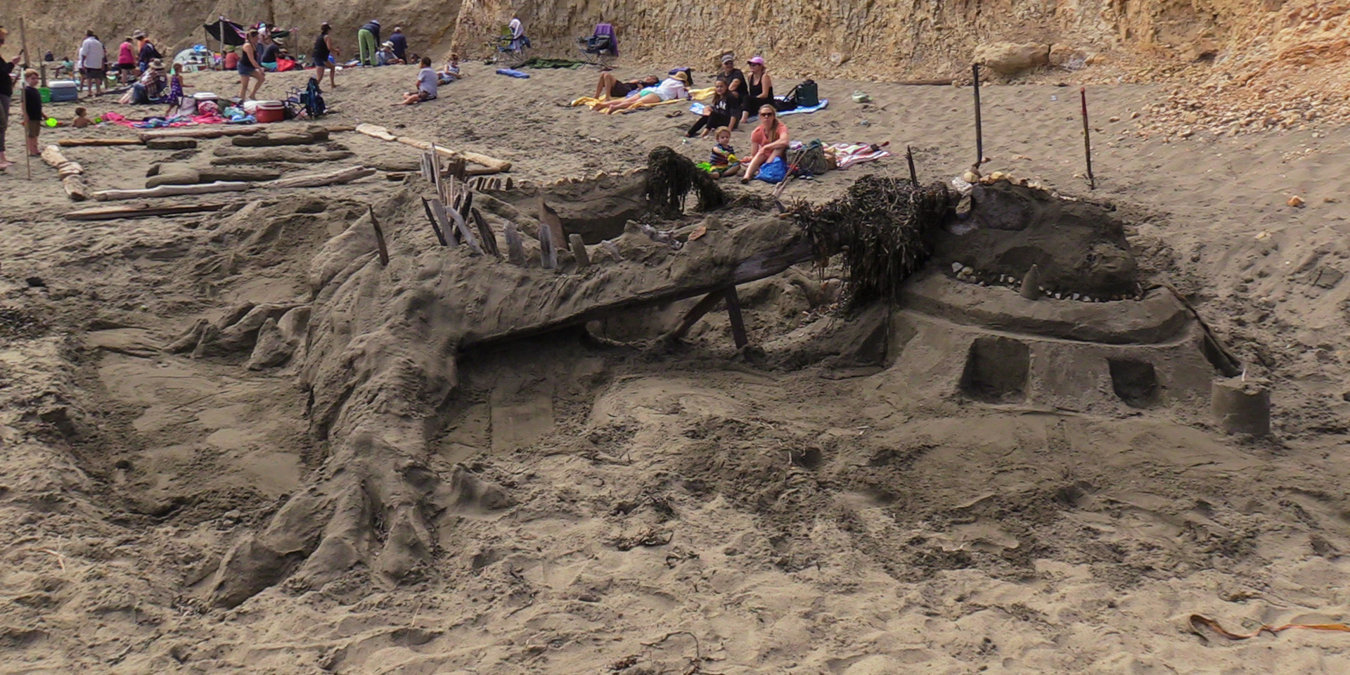 A large sand sculpture of a dragon.
