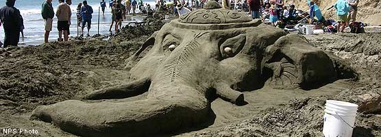 A sand sculpture of the head of an elephant.