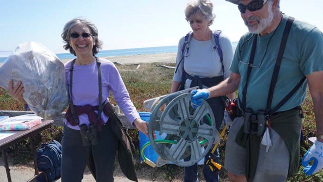 Volunteers display the litter they found on the beach