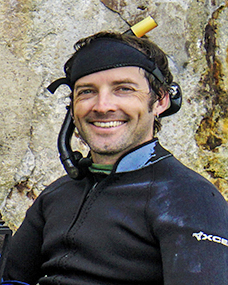 A man wearing a scuba suit